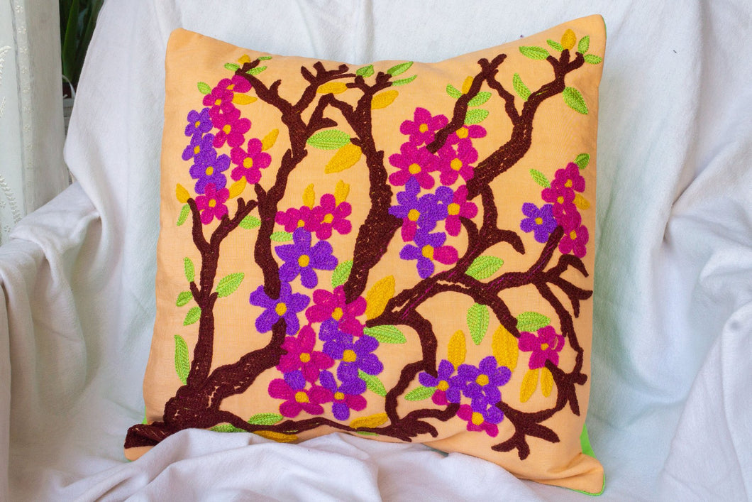 Elegant Springtime: Peach Cushion showcasing Embroidered Blossoming Tree with Delicate Flowers