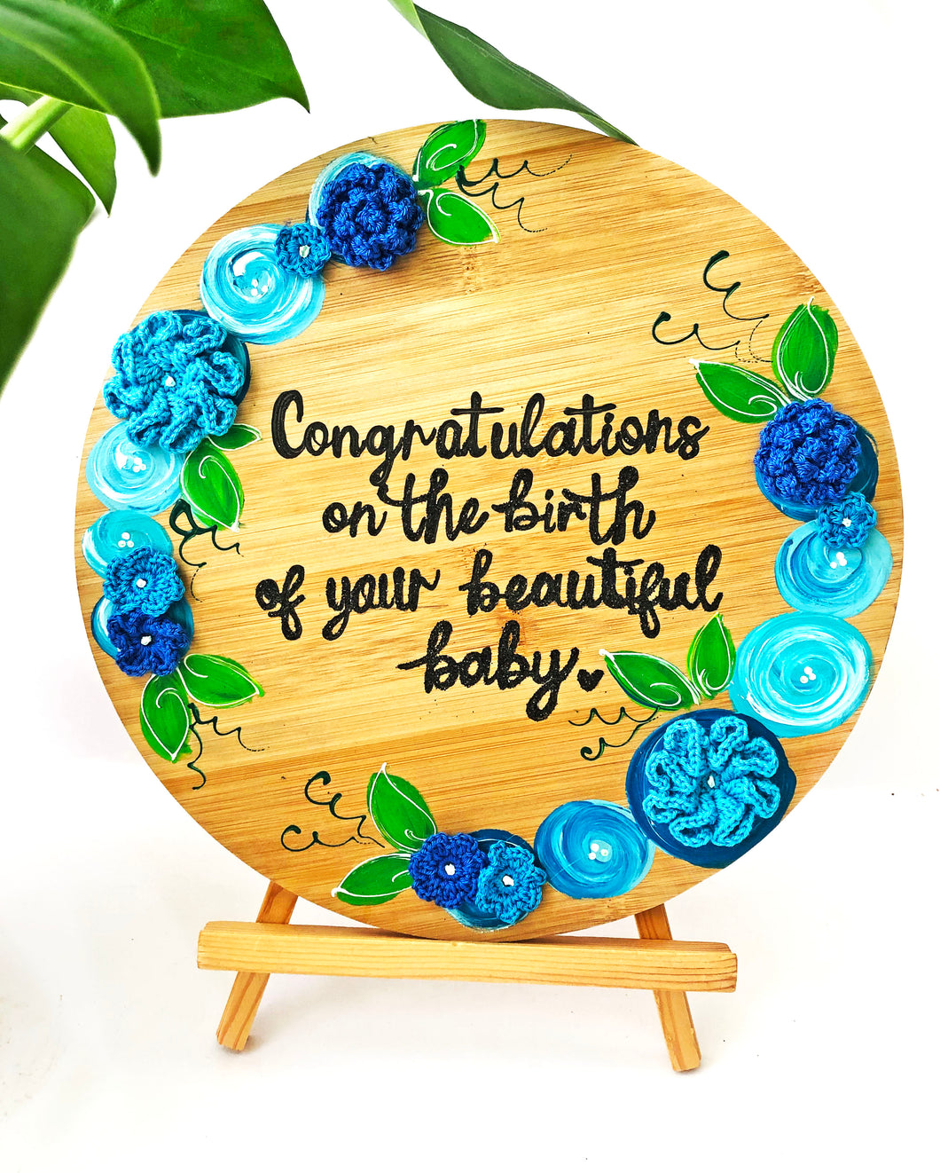 Handmade Round Wooden Board with Stand | Newborn Congratulations Gift with Blue Crochet Flowers