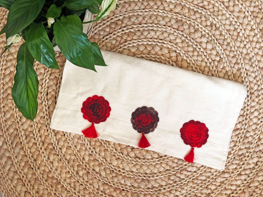 White Towel featuring Handcrafted Crochet Flowers and Tassels in red Tones
