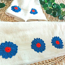 Load image into Gallery viewer, Timeless Floral Accents: Set of White Towel and Hand Towels featuring handmade crochet Flowers in Orange and Navy
