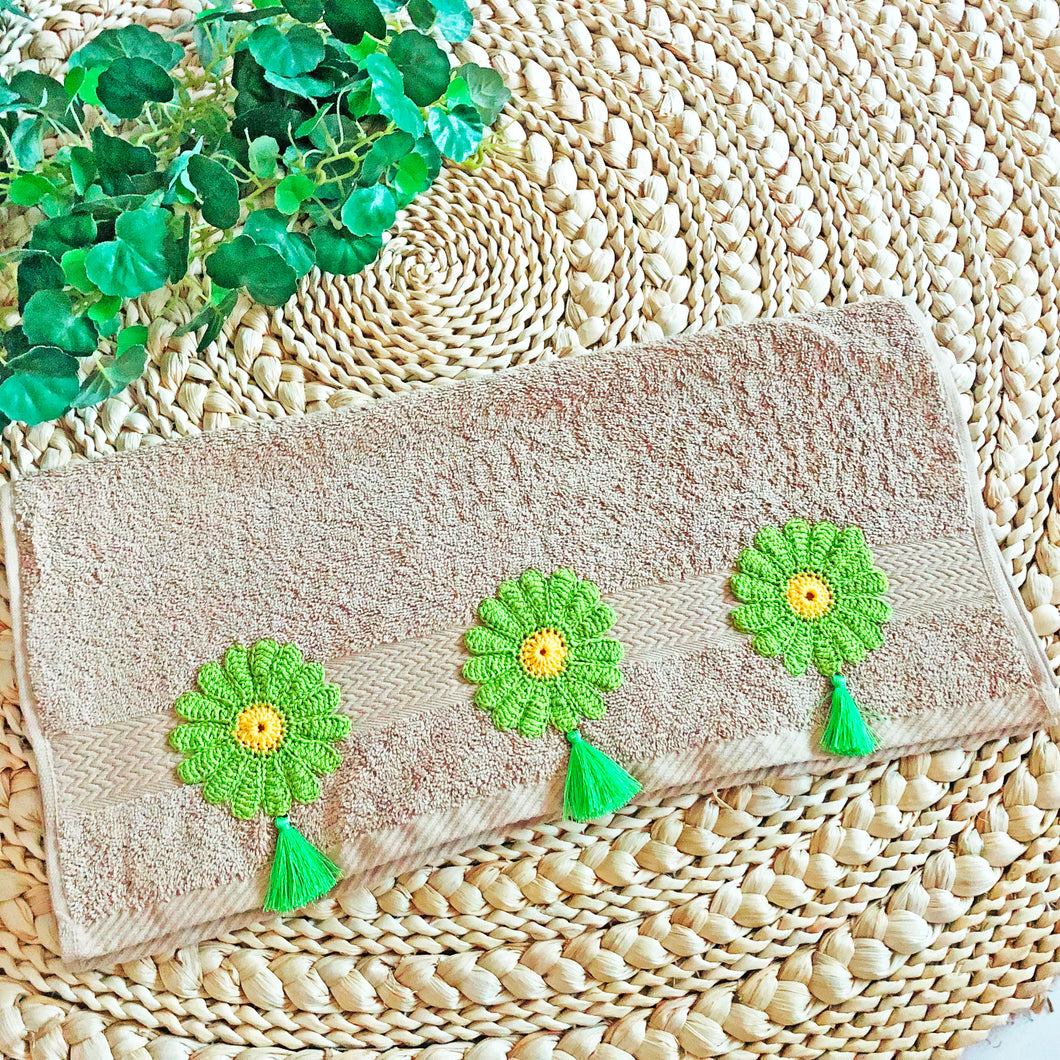 Daisy Dreams: Beige Towel with Hand Crochet Lime Green Flowers and Vibrant Yellow Centers