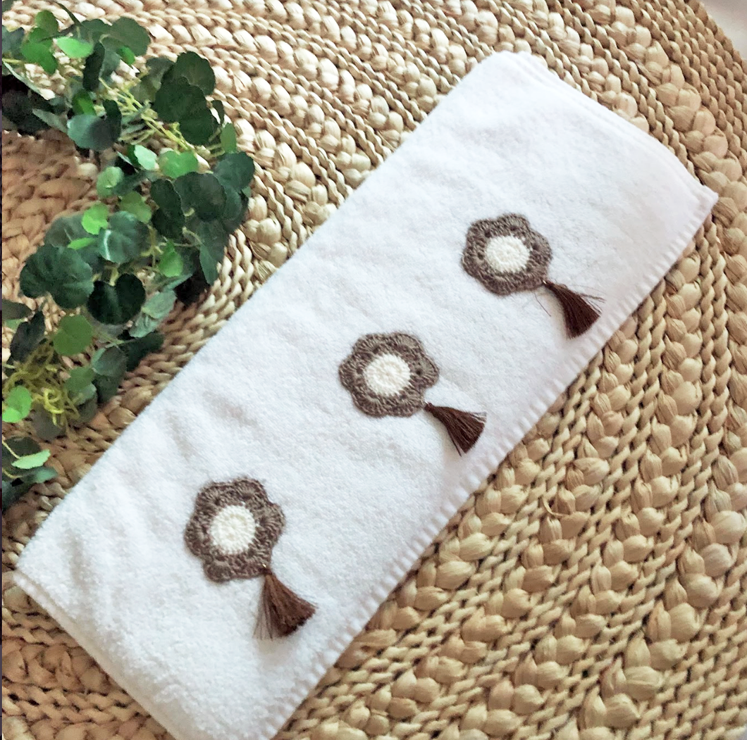 Subtle Elegance: White Towel with Three Handmade Crochet Flowers and Brown Tassel
